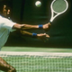 Arthur Ashe hits a ball during a match (Allsport)
